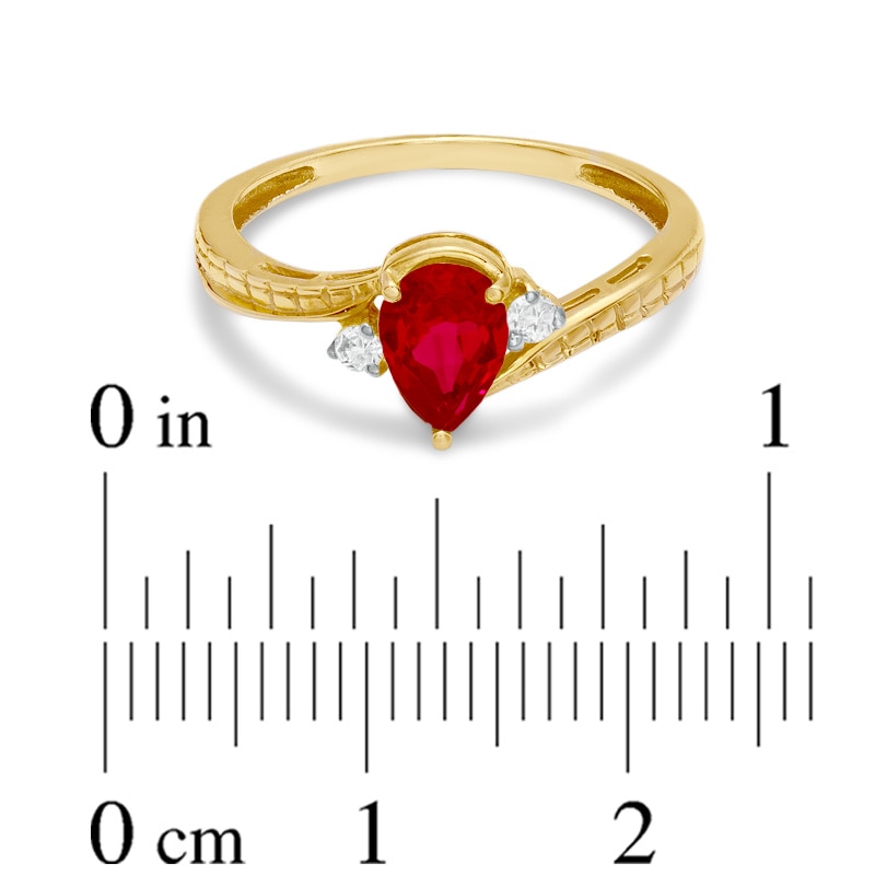 Main Image 3 of Previously Owned - Pear-Shaped Lab-Created Ruby and Diamond Accent Bypass Ring in 10K Gold