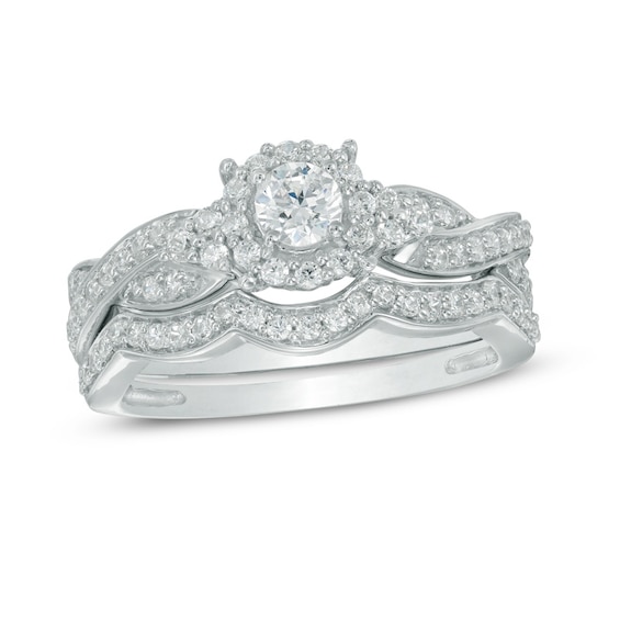 Previously Owned - 5/8 CT. T.w. Diamond Frame Twist Bridal Set in 10K White Gold