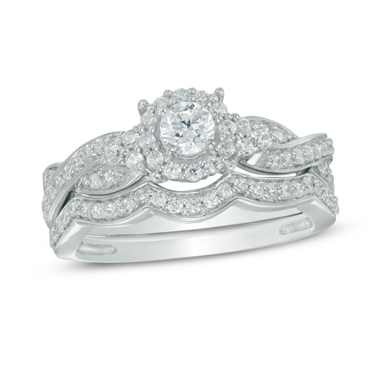 Main Image 1 of Previously Owned - 5/8 CT. T.W. Diamond Frame Twist Bridal Set in 10K White Gold