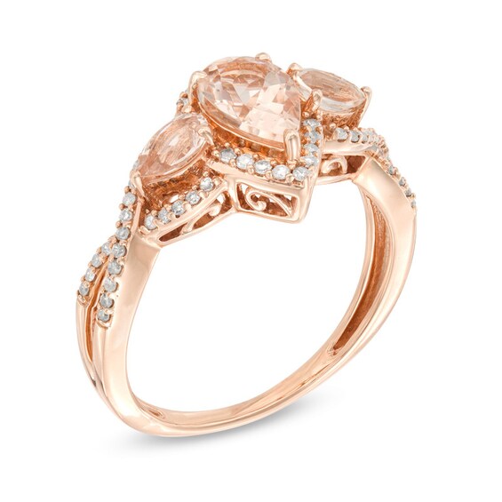 Previously Owned - Pear-Shaped Morganite and 1/5 CT. T.w. Diamond Twist Frame Three Stone Ring in 10K Rose Gold