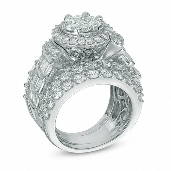 Previously Owned - 5 CT. T.w. Diamond Cluster Frame Three Piece Bridal Set in 14K White Gold