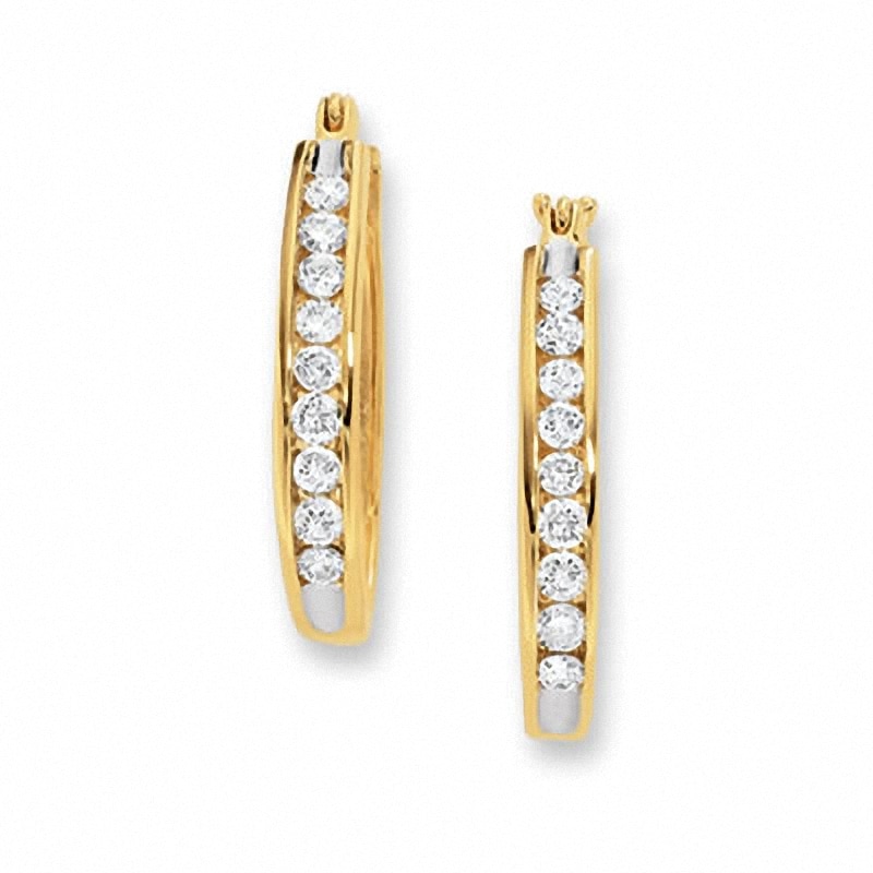 Main Image 1 of Previously Owned - 1/4 CT. T.W. Channel-Set Diamond Oval Hoop Earrings in 14K Gold