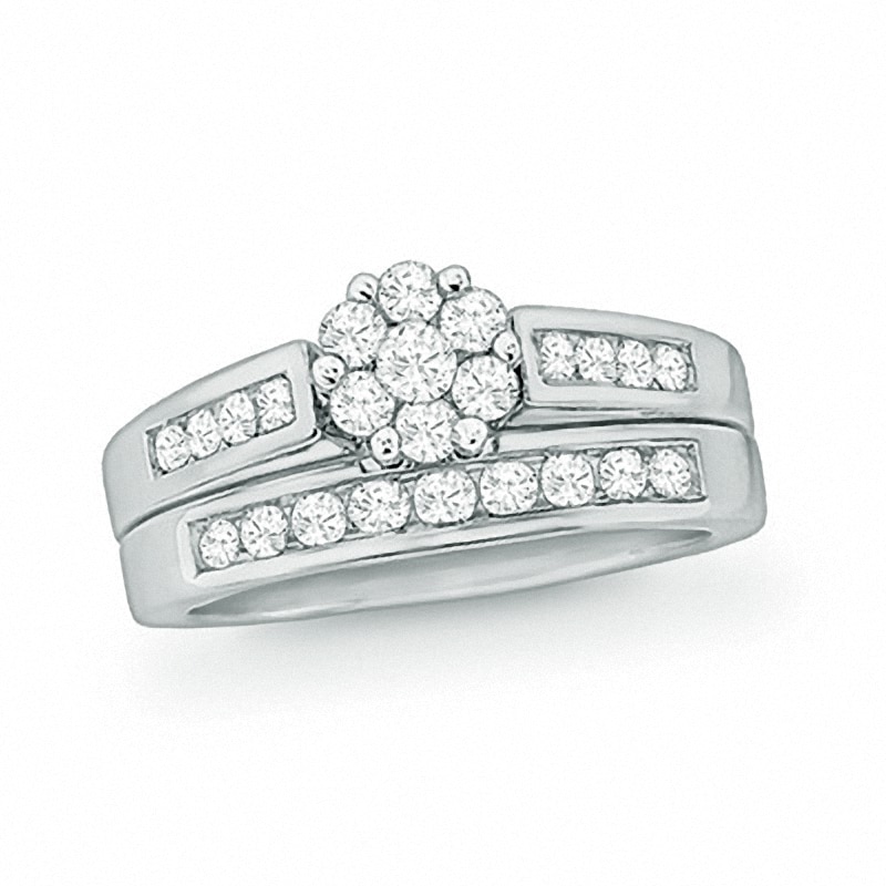 Previously Owned - 1/2 CT. T.W. Diamond Flower Bridal Set in 10K White Gold