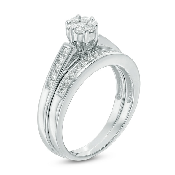 Previously Owned - 1/2 CT. T.w. Diamond Flower Bridal Set in 10K White Gold