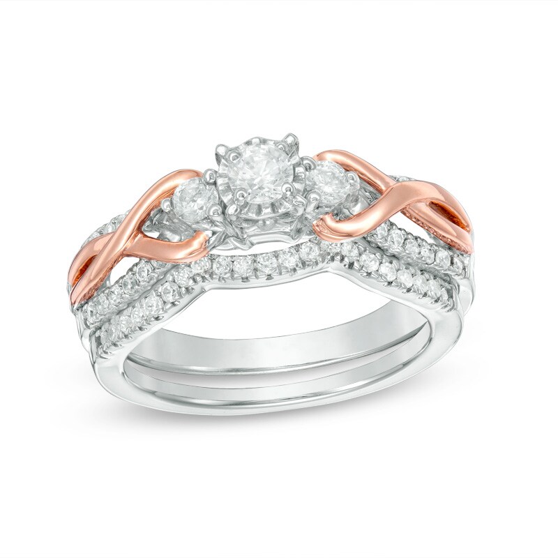 Main Image 1 of Previously Owned - 1/2 CT. T.W. Diamond Three Stone Loop Twist Bridal Set in 10K Two-Tone Gold