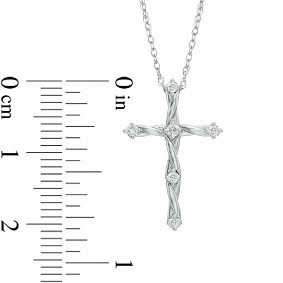 Previously Owned - 1/8 CT. T.w. Diamond Twisting Cross Pendant in 10K White Gold
