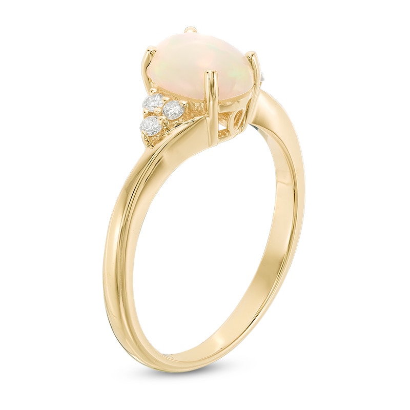 Main Image 2 of Previously Owned - Oval Opal and 1/10 CT. T.W. Diamond Tri-Sides Ring in 10K Gold