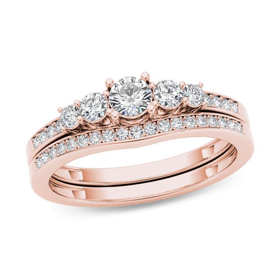Previously Owned - 1/2 CT. T.w. Diamond Five Stone Bridal Set in 14K Rose Gold
