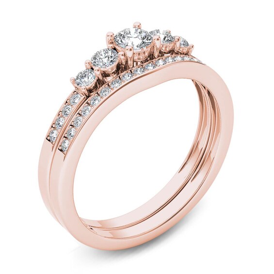 Previously Owned - 1/2 CT. T.w. Diamond Five Stone Bridal Set in 14K Rose Gold
