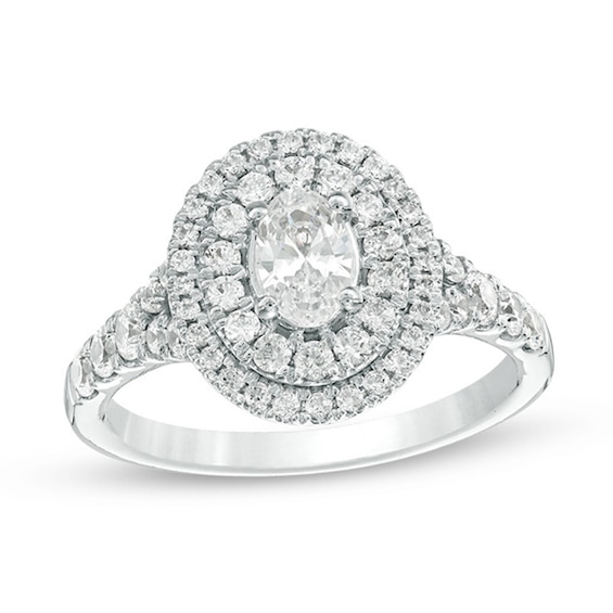 Previously Owned - Celebration Ideal 1-1/4 CT. T.w. Oval Diamond Double Frame Engagement Ring in 14K White Gold