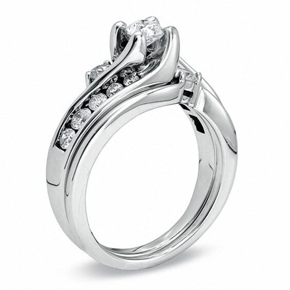 Previously Owned - 1 CT. T.w. Diamond Three Stone Slant Bridal Set in 14K White Gold