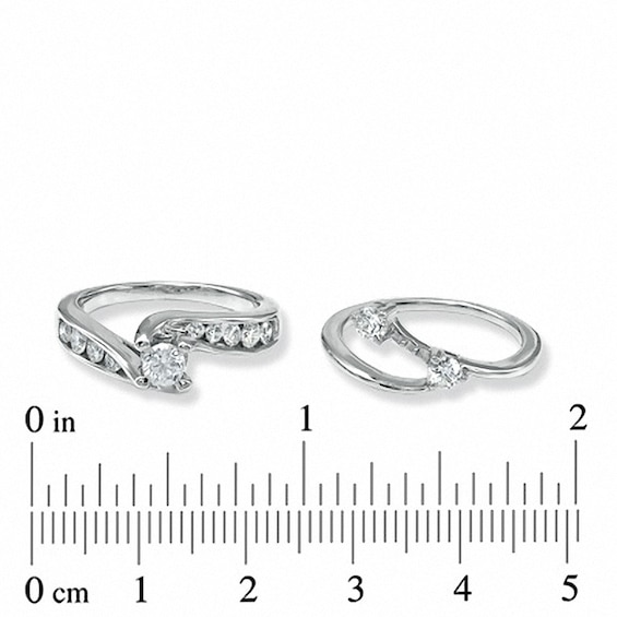 Previously Owned - 1 CT. T.w. Diamond Three Stone Slant Bridal Set in 14K White Gold