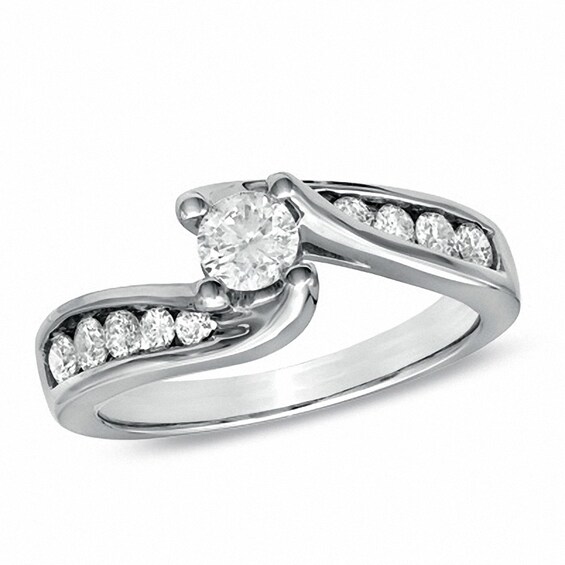 Previously Owned - 1 CT. T.w. Diamond Three Stone Slant Bridal Set in 14K White Gold