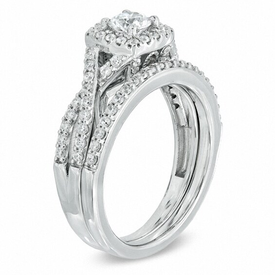 Previously Owned - Celebration Ideal 1 CT. T.w. Diamond Frame Bridal Set in 14K White Gold (I/I1)