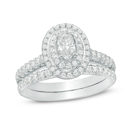 Previously Owned - 1-1/4 CT. T.w. Oval Diamond Double Frame Bridal Set in 14K White Gold