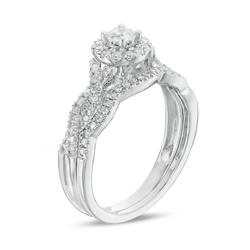 Main Image 2 of Previously Owned - 1/2 CT. T.W. Diamond Frame Twist Bridal Set in 10K White Gold