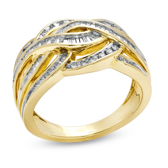 Previously Owned - 3/8 CT. T.w. Baguette and Round Diamond Twist Band in 10K Gold