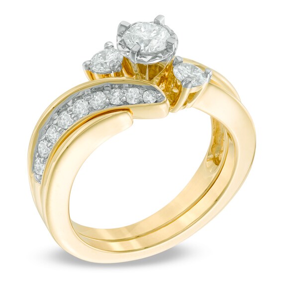 Previously Owned - 1 CT. T.w. Diamond Three Stone Slant Bridal Set in 14K Gold