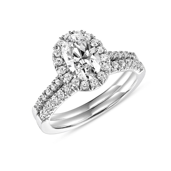 Previously Owned - 3/4 CT. T.w. Oval Diamond Frame Bridal Set in 14K White Gold