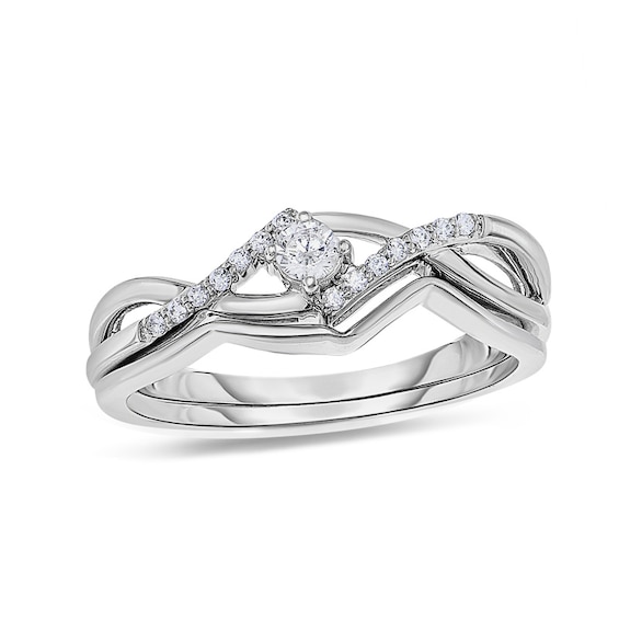 Previously Owned - 1/6 CT. T.w. Diamond Twist Bridal Set in 10K White Gold