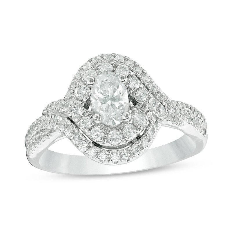 Previously Owned - Celebration Ideal 1 CT. T.W. Oval Diamond Bypass Frame Engagement Ring in 14K White Gold (I/I1)