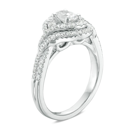 Previously Owned - Celebration Ideal 1 CT. T.w. Oval Diamond Bypass Frame Engagement Ring in 14K White Gold (I/I1)