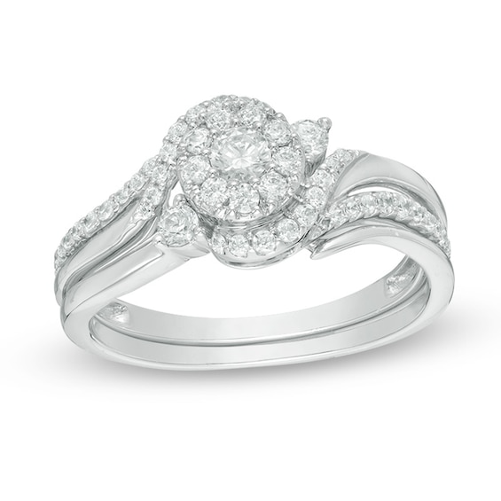 Previously Owned 1/2 CT. T.w. Diamond Swirl Bypass Frame Soldered Bridal Set in 10K White Gold