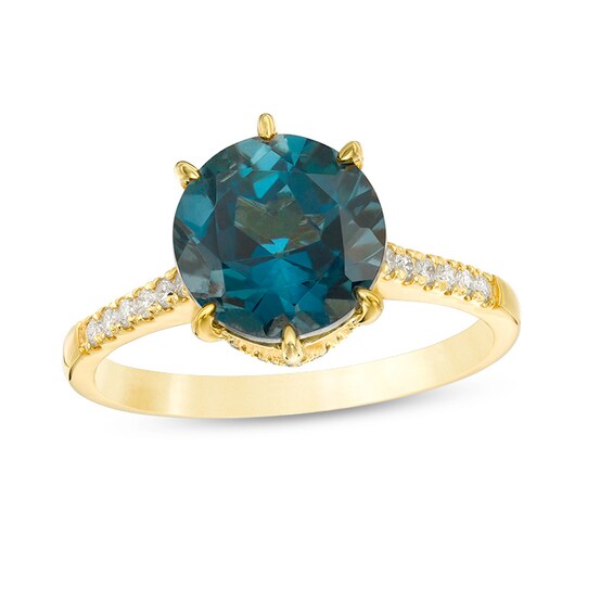 Previously Owned - 9.0mm London Blue Topaz and 1/4 CT. T.w. Diamond Ring in 14K Gold