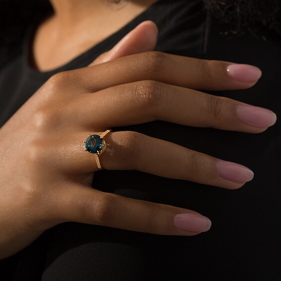 Previously Owned - 9.0mm London Blue Topaz and 1/4 CT. T.w. Diamond Ring in 14K Gold