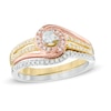 Thumbnail Image 1 of Previously Owned - 1/3 CT. T.W. Diamond Swirl Bridal Set in 10K Tri-Tone Gold