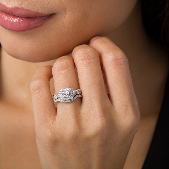 Previously Owned - 1-1/2 CT. T.w. Princess-Cut Diamond Three Stone Frame Twist Bridal Set in 10K White Gold