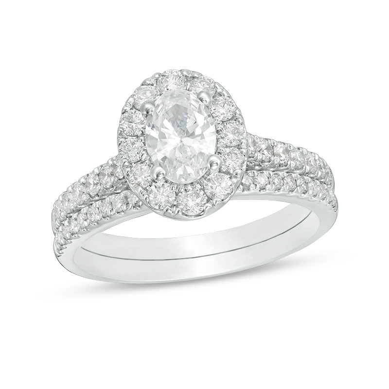 Main Image 1 of Previously Owned - Celebration Ideal 1-1/2 CT. T.W. Oval Diamond Frame Bridal Set in 14K White Gold (I/I1)