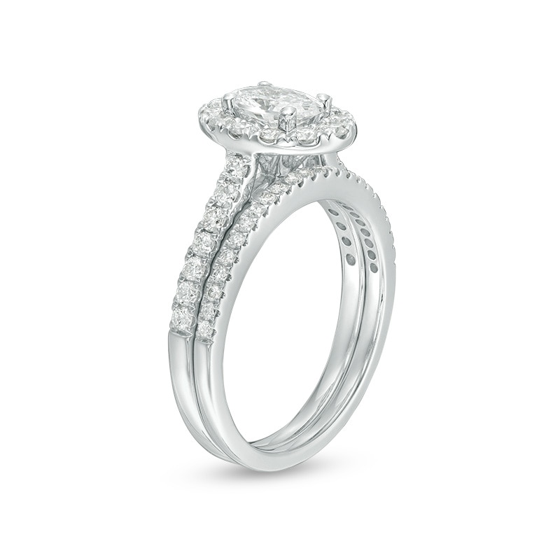Main Image 2 of Previously Owned - Celebration Ideal 1-1/2 CT. T.W. Oval Diamond Frame Bridal Set in 14K White Gold (I/I1)