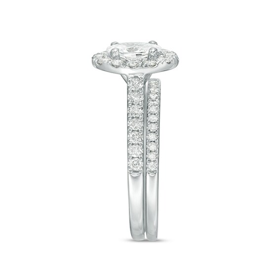 Previously Owned - Celebration Ideal 1-1/2 CT. T.w. Oval Diamond Frame Bridal Set in 14K White Gold (I/I1)