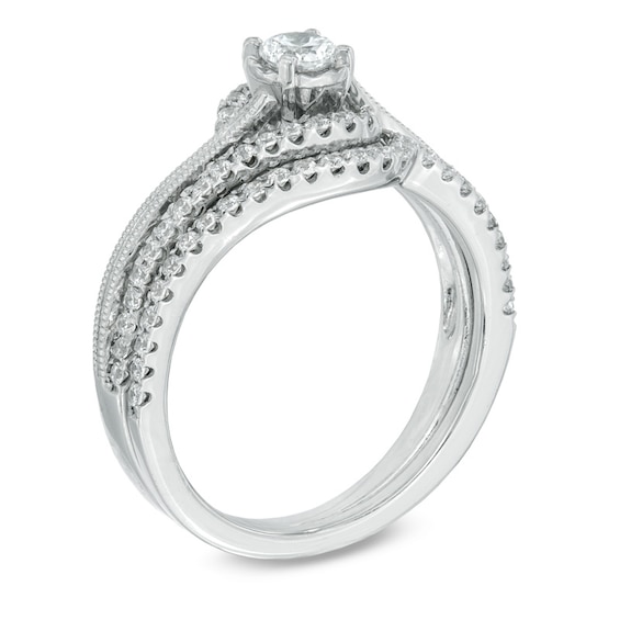 Previously Owned - 1/2 CT. T.w. Diamond Milgrain Swirl Frame Bridal Set in 10K White Gold