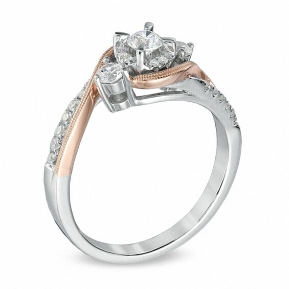 Previously Owned - 1/2 CT. T.w. Diamond Three Stone Swirl Engagement Ring in 10K Two-Tone Gold