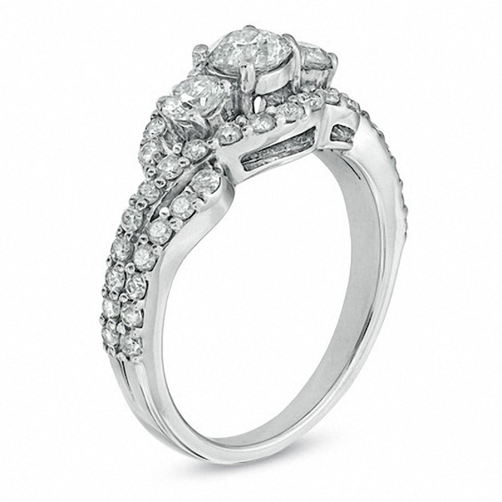 Previously Owned - 1-1/2 CT. T.w. Diamond Three Stone Frame Ring in PlatinaireÂ®