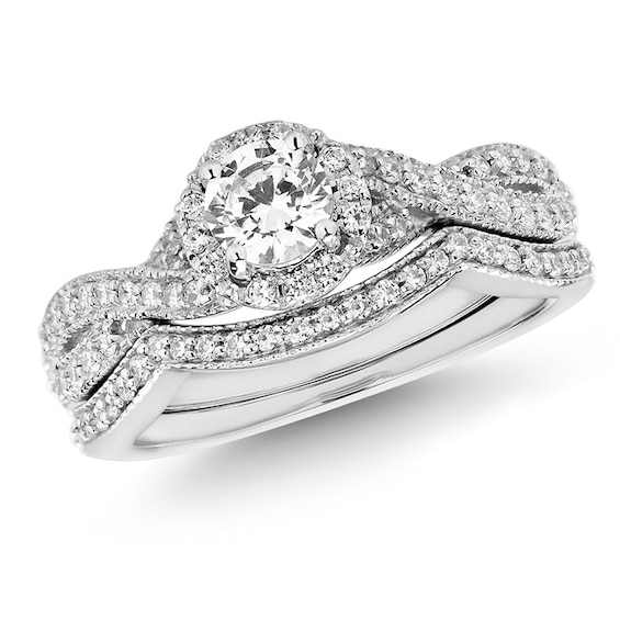 Previously Owned - 3/4 CT. T.w. Diamond Twist Shank Bridal Set in 14K White Gold