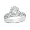 Thumbnail Image 1 of Previously Owned - 3/4 CT. T.W. Oval Diamond Double Frame Twist Vintage-Style Bridal Set in 14K White Gold