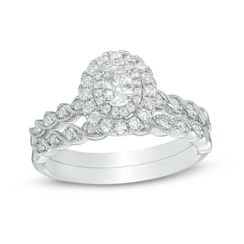 Main Image 1 of Previously Owned - 3/4 CT. T.W. Oval Diamond Double Frame Twist Vintage-Style Bridal Set in 14K White Gold