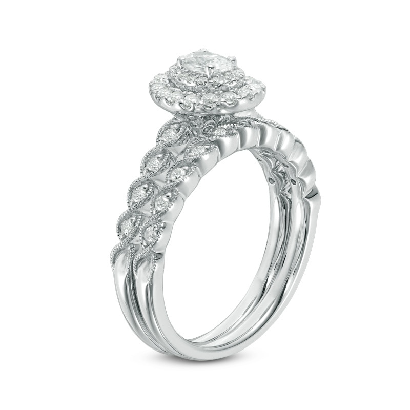 Main Image 2 of Previously Owned - 3/4 CT. T.W. Oval Diamond Double Frame Twist Vintage-Style Bridal Set in 14K White Gold