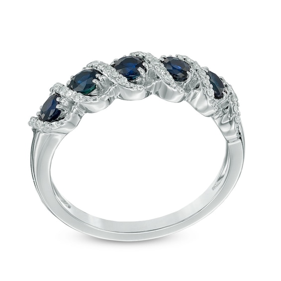 Previously Owned - Blue Sapphire and 1/10 CT. T.w. Diamond Frame Five Stone Ring in 10K White Gold