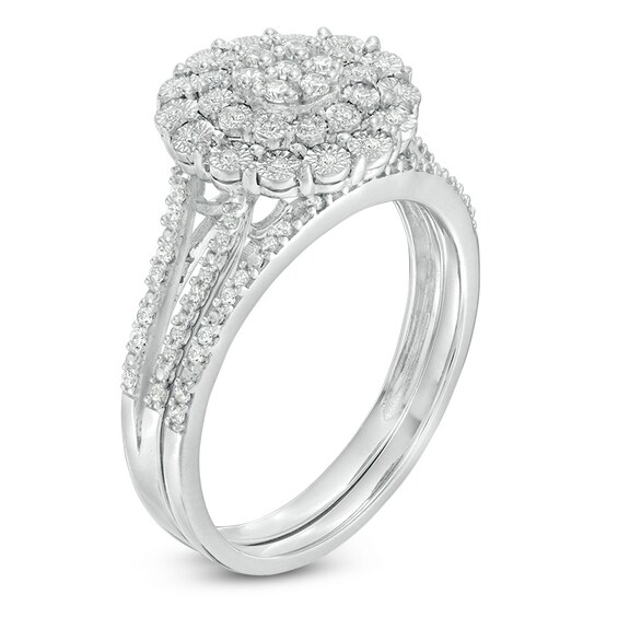 Previously Owned - 1/4 CT. T.w. Composite Diamond Flower Bridal Set in Sterling Silver