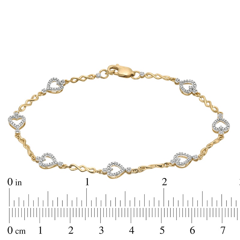 Main Image 4 of Previously Owned - 1/10 CT. T.W. Diamond Sideways Heart Station Twist Bracelet in 10K Gold - 7.5"