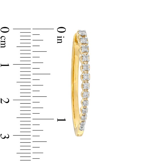 Previously Owned - 1/2 CT. T.w. Diamond Oval Hoop Earrings in 10K Gold