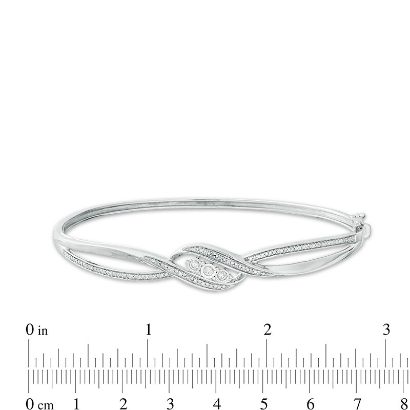 Main Image 2 of Previously Owned - 1/5 CT. T.W. Diamond Three Stone Bypass Ribbon Bangle in Sterling Silver