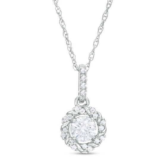 Previously Owned - 1/4 CT. T.w. Diamond Twist Frame Pendant in 10K White Gold