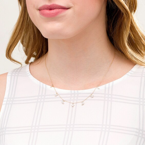 Previously Owned - 1/6 CT. T.w. Diamond Crescent Moon and Star Station Necklace in 10K Gold - 19"