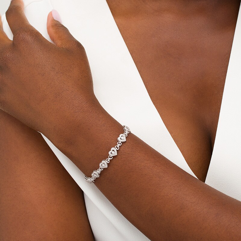 Main Image 2 of Previously Owned - 1/4 CT. T.W. Diamond Hearts Line Bracelet in Sterling Silver