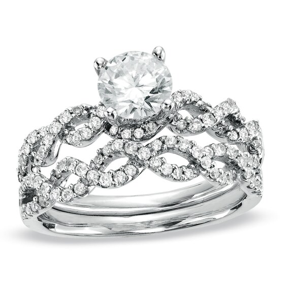 Previously Owned - 1-1/4 CT. T.w. Diamond Twist Bridal Set in 14K White Gold